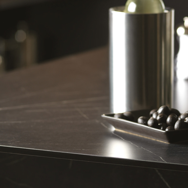 Tray of blueberries and wine cooler on a neo graphite kitchen worktop